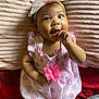 Aniyrah Scott is registered to the contest to win money with this photo: baby, child, infant, headband, bow, dress, flower, hand, fingers, blanket, texture, heart_pattern, cute, lying_down, adorable, portrait, smiling, skin, indoors, person
