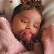 Selena is registered to the contest to win money with this photo: baby, infant, sleeping, pacifier, pink_blanket, brown_bows, teddy_bear, nursery, bed, cozy, portrait, close_up, face, peaceful, indoors, bedding, hearts, soft_lighting, child, resting