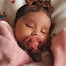 baby, infant, sleeping, pacifier, pink_blanket, brown_bows, teddy_bear, nursery, bed, cozy, portrait, close_up, face, peaceful, indoors, bedding, hearts, soft_lighting, child, resting