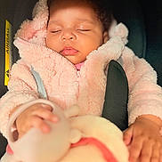 Shayana participe au concours pour gagner de l'argent avec cette photo : baby, infant, sleeping, car_seat, harness, pink_jacket, hood, fleece, cozy, closeup, portrait, hand, toy, soft_texture, lips, eyelashes, seat, airbag_label, cute, indoors
