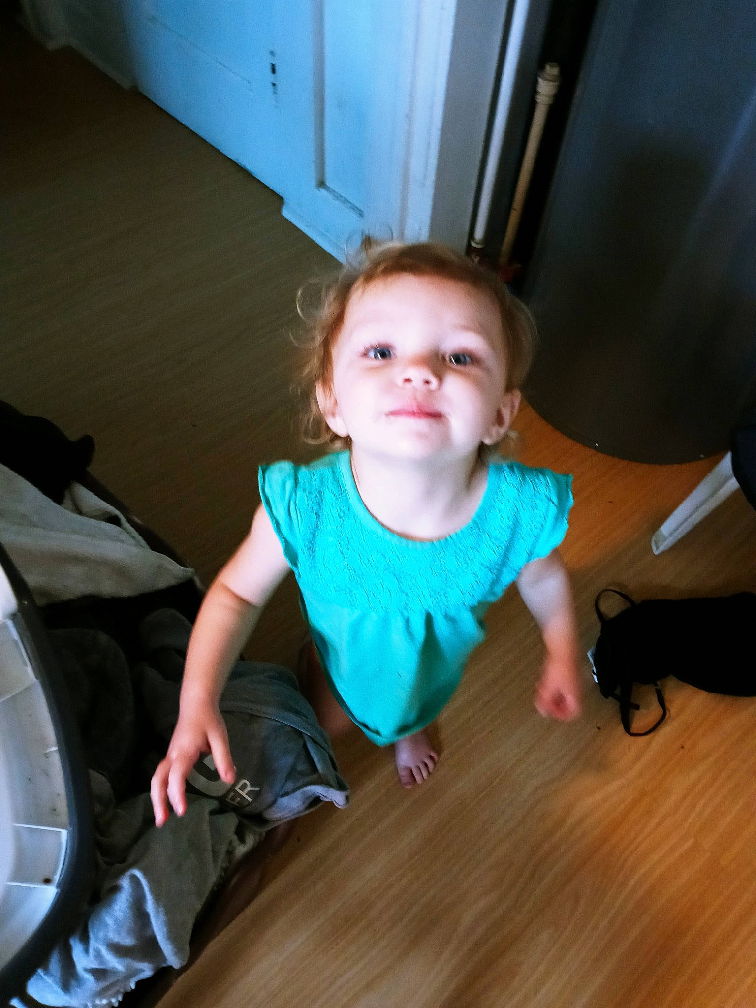 Charlie is registered to the contest to win money with this photo: baby, baby_toddler_clothing, comfort, finger, flash_photography, floor, flooring, fun, happy, hardwood, human_leg, iris, joint, leg, leisure, person, sitting, skin, smile, toddler