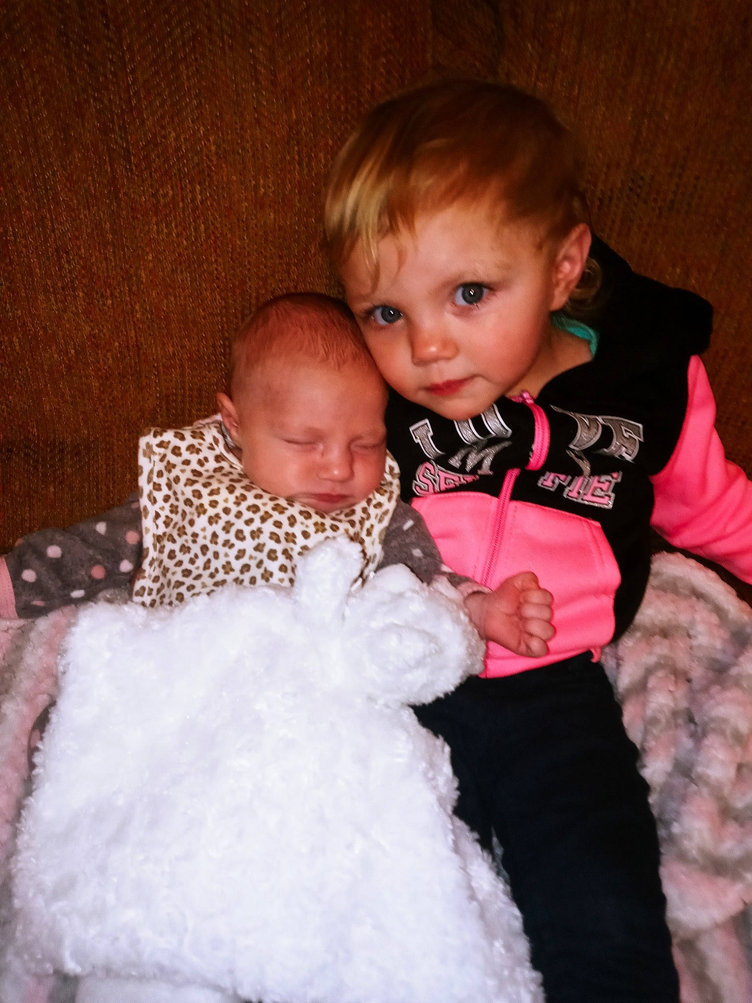 Charlie is registered to the contest to win money with this photo: arm, baby, baby_toddler_clothing, cheek, child, comfort, couch, facial_expression, finger, flash_photography, fun, happy, human, interaction, iris, person, skin, sleeve, smile, standing