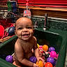 Kailani is registered to the contest to win money with this photo: baby, bath, child, colorful_balls, cute, dish_soap, face, faucet, furniture, happy, indoor, kitchen, person, plastic_balls, playful, red_blinds, sink, smiling, toddler, water