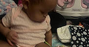 Kailani joined the competition — help win amazing prizes! baby, baby_seat, blanket, child, cute, diaper, focus, hair, home, indoor, infant, onesie, person, pink, playtime, polka_dot, sitting, soft_lighting, toddler, toy