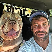 Sir Loki joined the competition — help win amazing prizes! man, dog, selfie, car, smile, happy, cap, tattoo, pet, inside, seat, window, leash, tongue_out, beard, casual, friendship, closeup, portrait, daylight