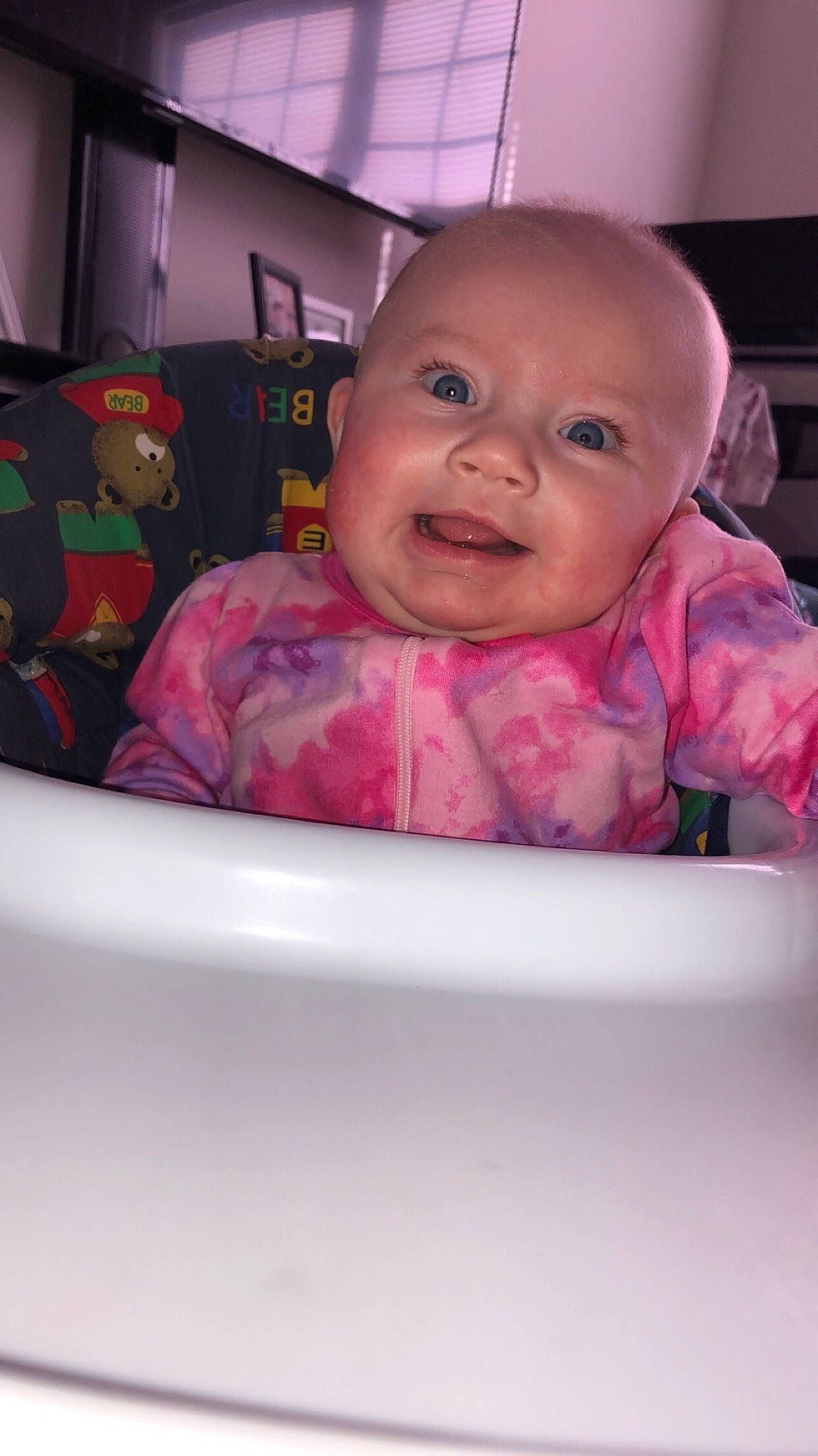 Isabelle is registered to the contest to win money with this photo: baby, baby_products, baby_safety, baby_toddler_clothing, bathing, cheek, comfort, eyelash, fun, happy, iris, lip, magenta, person, pink, purple, room, sitting, sleeve, smile