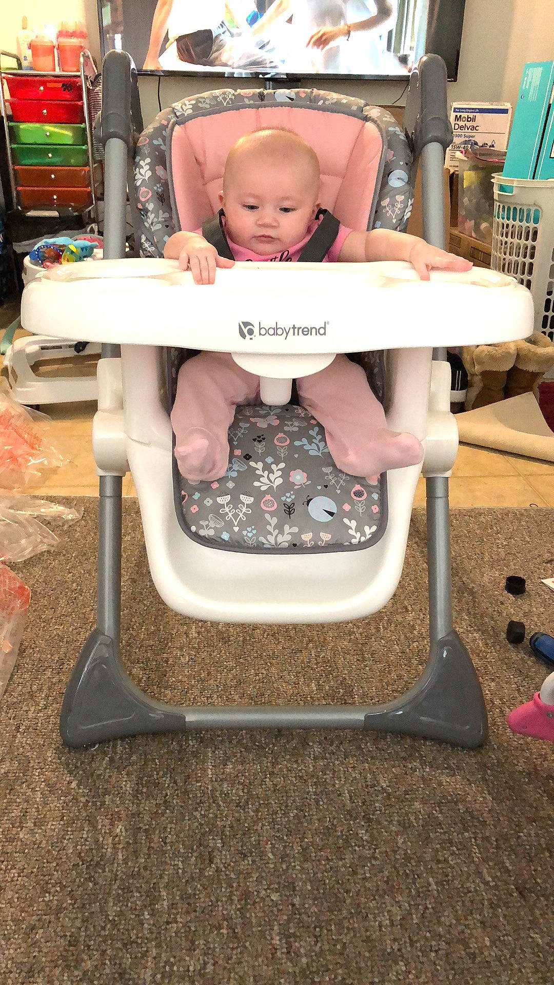 Isabelle is registered to the contest to win money with this photo: baby, baby_carriage, baby_products, baby_safety, baby_toddler_clothing, chair, child, comfort, cooking, folding_chair, fun, gas, lap, leisure, person, pink, recreation, shorts, sitting, toddler
