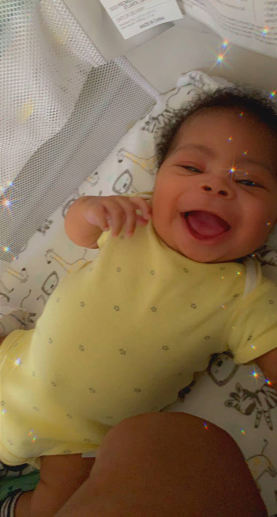 Caiden joined the competition — help win amazing prizes! baby, baby_laughing, baby_products, baby_safety, baby_toddler_clothing, cheek, child, comfort, face, happy, infant_bodysuit, linens, nose, pattern, person, pink, product, skin, smile, textile