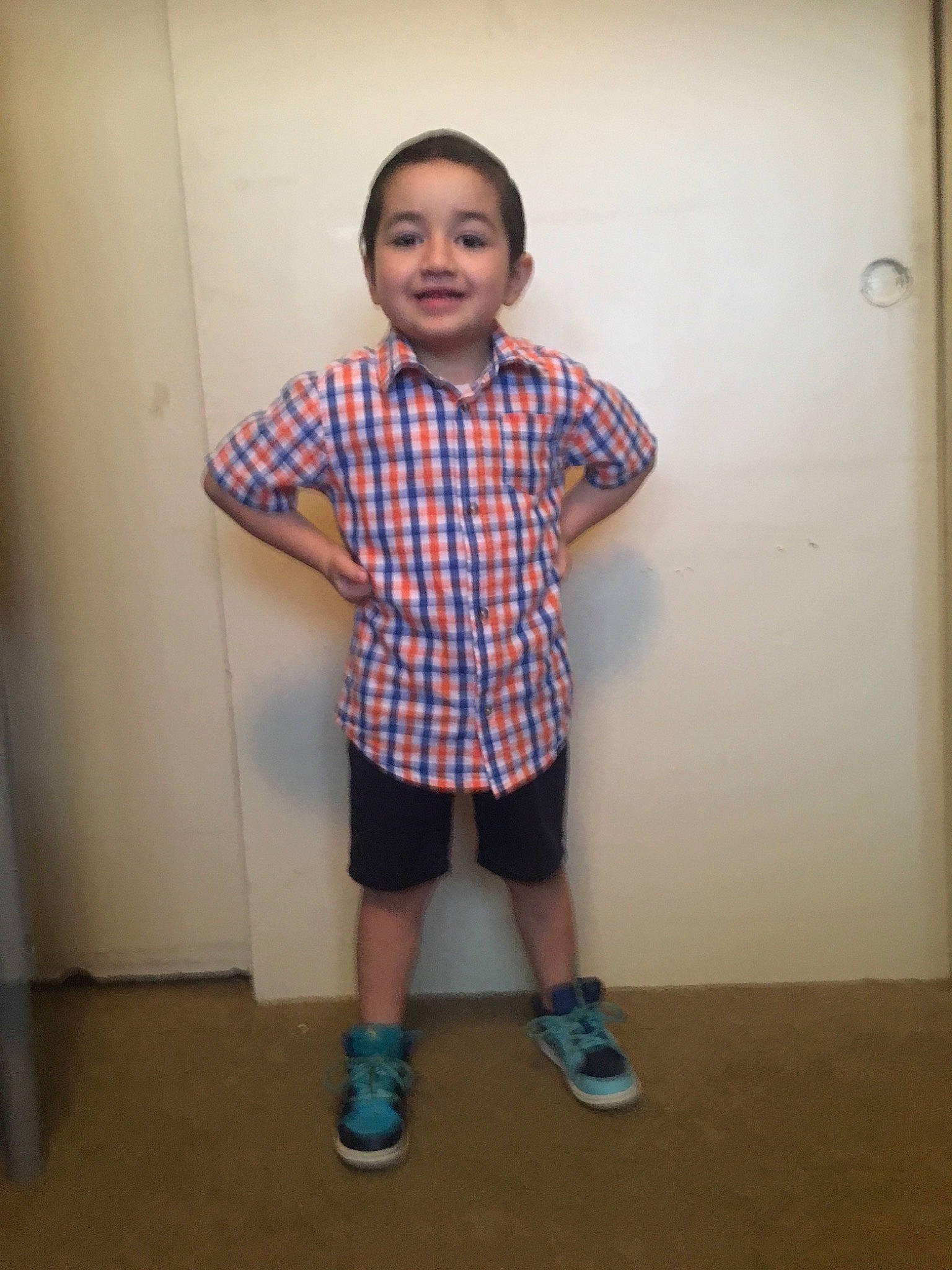 Joshua is registered to the contest to win money with this photo: child, design, joint, joy, knee, pattern, person, plaid, shirt, shoe, shorts, shoulder, sleeve, standing, t_shirt, tartan, textile, uniform
