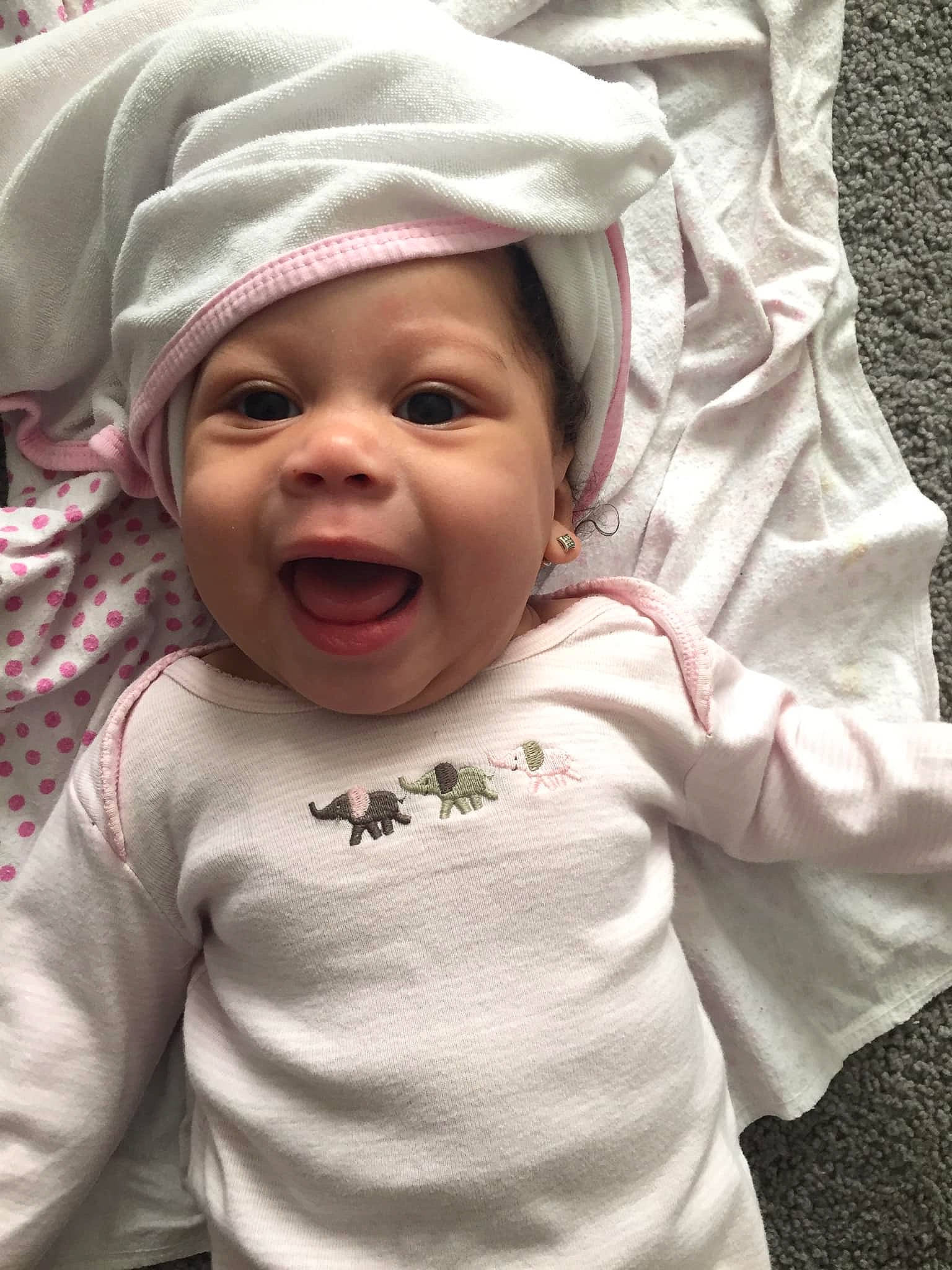 Aubri joined the competition — help win amazing prizes! baby, bonnet, cheek, child, facial_expression, headgear, headwear, laugh, person, skin, smile, toddler