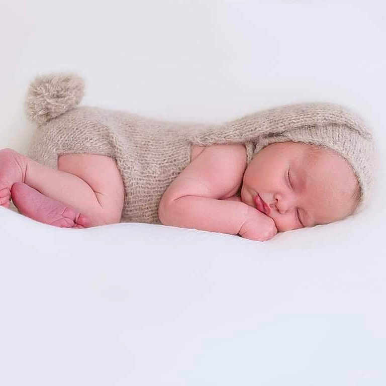 Brodie joined the competition — help win amazing prizes! baby, blanket, clothing, face, happy, hat, head, newborn, person, photography, portrait, sleeping, smile