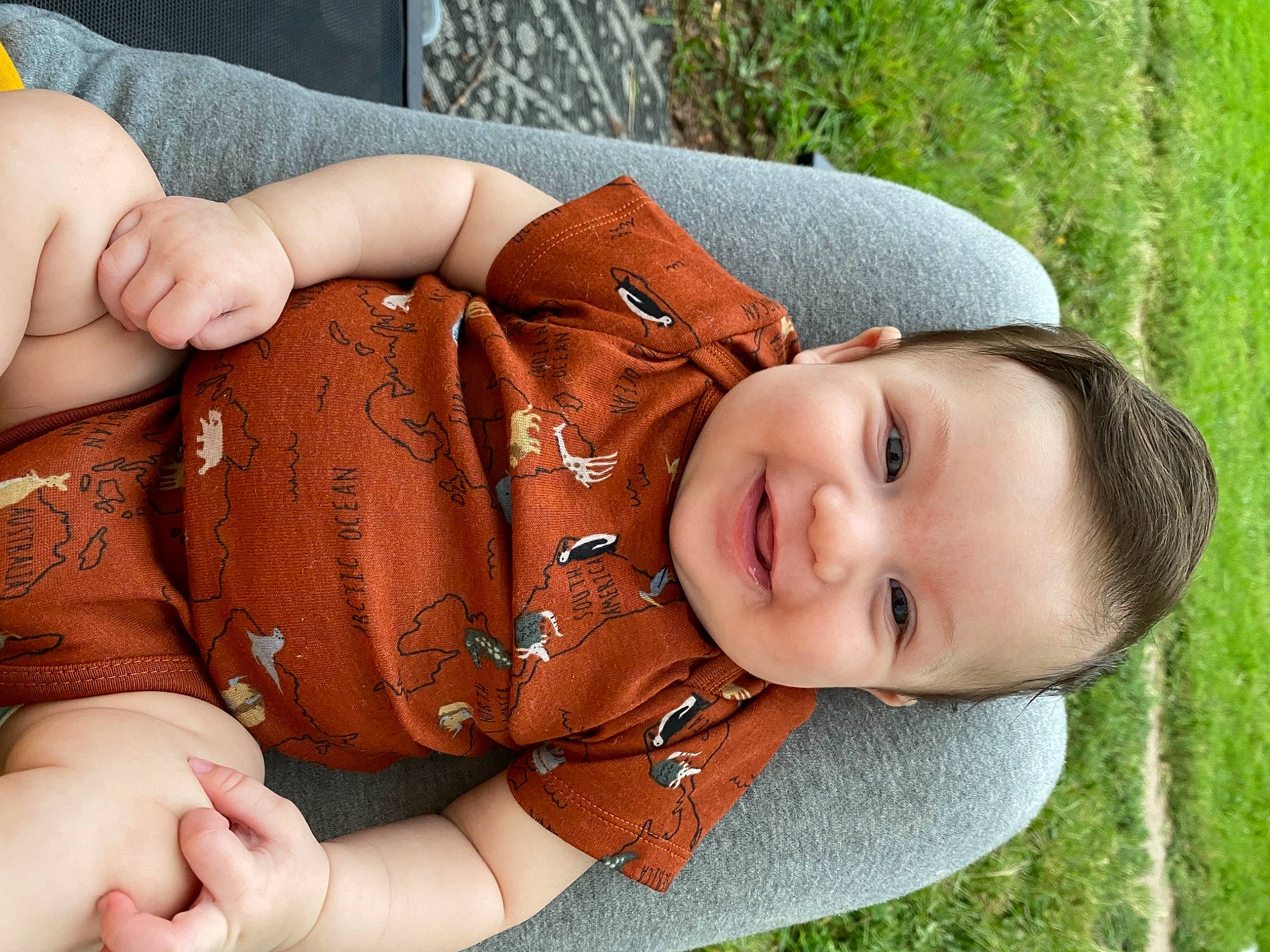 Holden is registered to the contest to win money with this photo: baby, baby_toddler_clothing, blond, child, comfort, grass, hand, happy, headgear, joy, muscle, pattern, people_in_nature, person, plant, sitting, skin, smile, toddler, tree