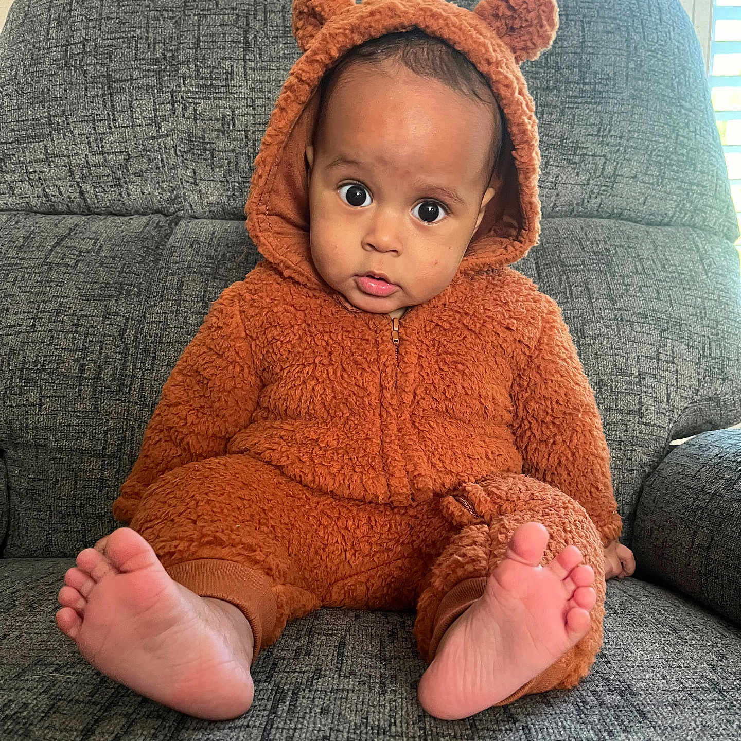 Ayden joined the competition — help win amazing prizes! baby, bonnet, chair, clothing, couch, cushion, face, furniture, hat, head, homedecor, hood, hoodie, knitwear, person, photography, portrait, sitting, sweater, sweatshirt