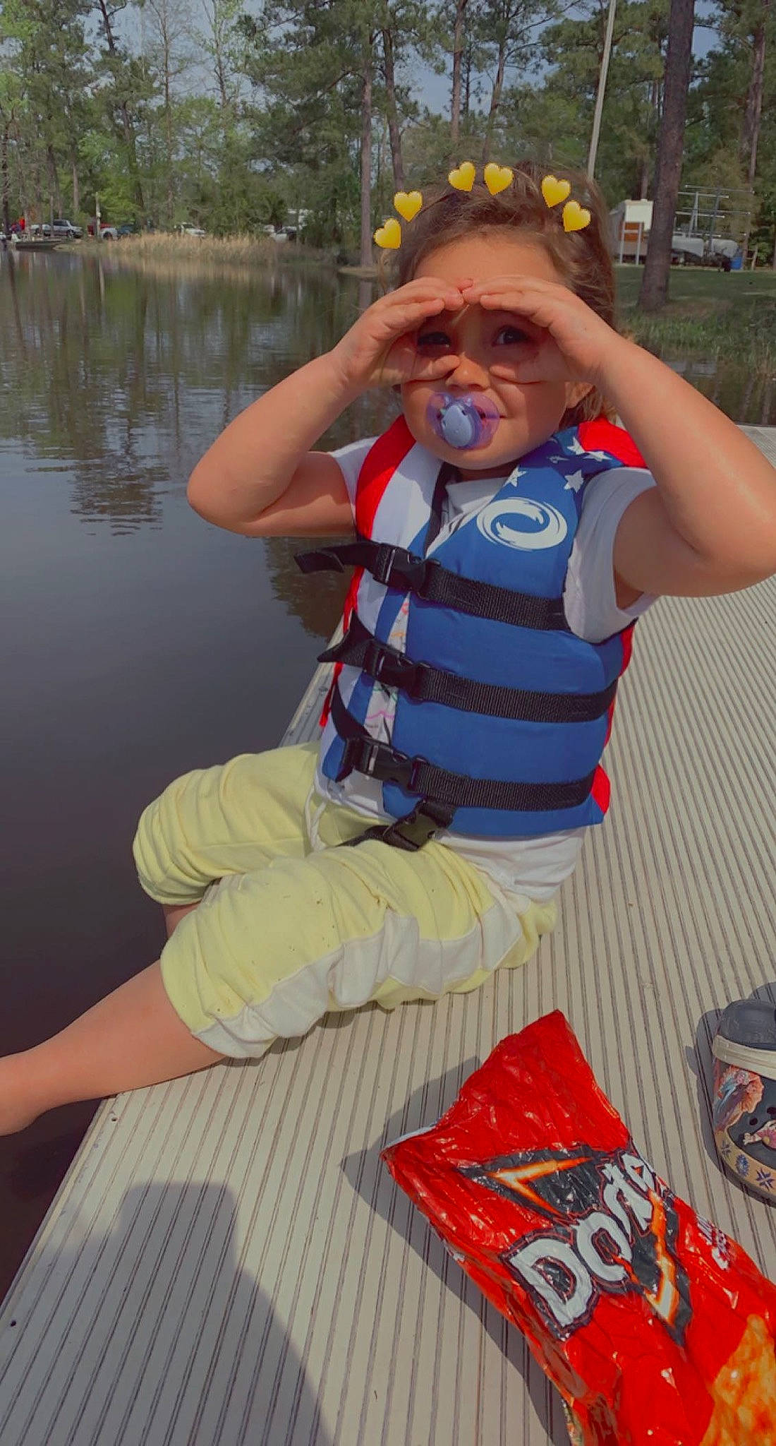 Gigi is registered to the contest to win money with this photo: boats_and_boating_equipment_and_supplies, carmine, eyewear, fun, goggles, happy, hat, lake, leg, leisure, lifejacket, logo, person, personal_protective_equipment, recreation, shorts, smile, sunglasses, t_shirt, thigh