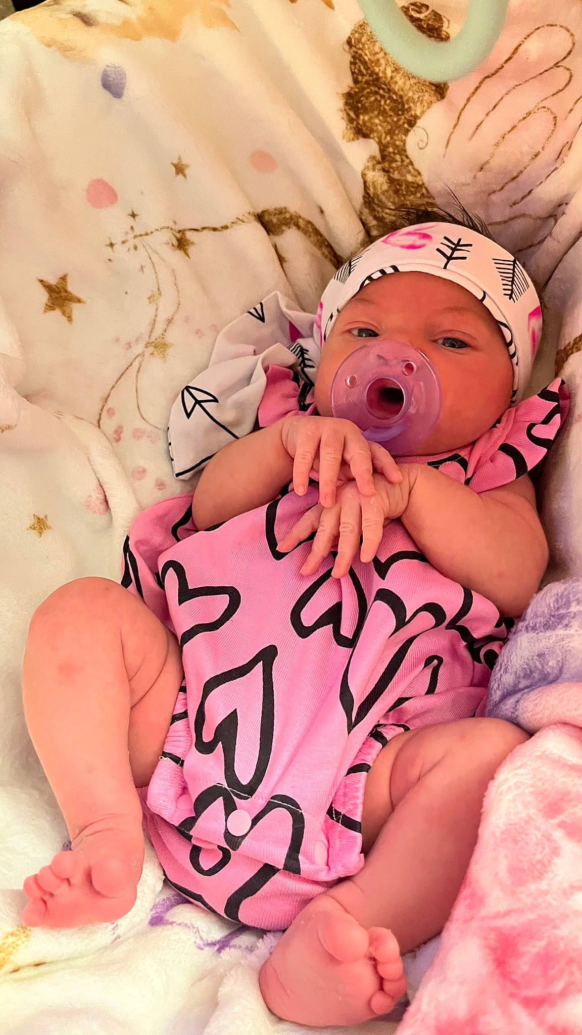 Cali is registered to the contest to win money with this photo: baby, baby_sleeping, baby_toddler_clothing, cheek, child, comfort, facial_expression, finger, gesture, hand, happy, headwear, human_body, mouth, muscle, person, pink, skin, stomach, thigh