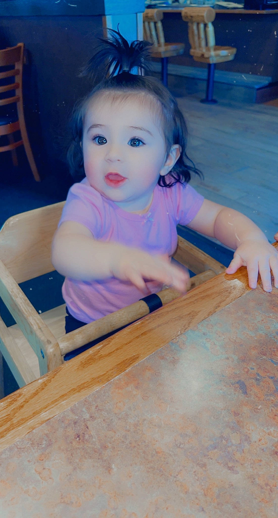 Emmalynn is registered to the contest to win money with this photo: baby_toddler_clothing, chair, dress, eye, flooring, furniture, hair, hand, happy, hardwood, iris, leisure, person, recreation, skin, smile, table, toddler, varnish, wood