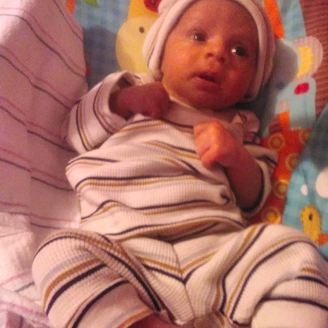 Sarai is registered to the contest to win money with this photo: baby, baby_products, baby_safety, baby_sleeping, baby_toddler_clothing, beanie, bedtime, cheek, child, comfort, head, linens, mouth, nose, person, room, skin, sleep, textile, thumb