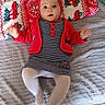 baby, bed, blanket, child, cozy, cute, feet, floor_tiles, home, indoor, infant, lying_down, person, red_headband, red_jacket, socks, striped_dress, toy, warm_clothing, white_tights