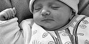Jade participe au concours pour gagner de l'argent avec cette photo : baby, blanket, child, closeup, comfort, cozy, cute, face, hat, infant, monochrome, newborn, onesie, pattern, peaceful, portrait, quiet, resting, sleeping, soft