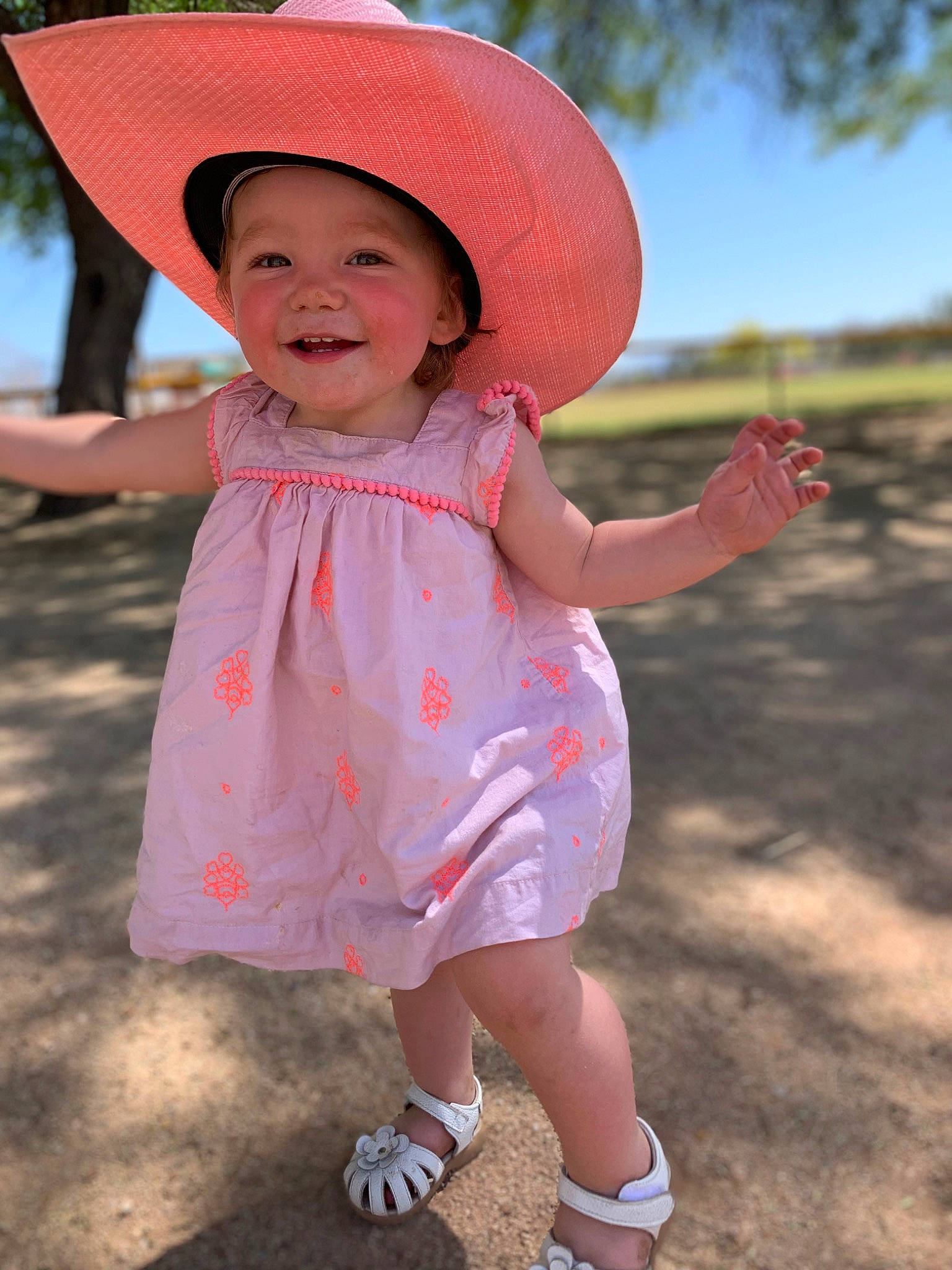 Memphis is registered to the contest to win money with this photo: baby_toddler_clothing, clothing, facial_expression, fun, grass, happy, hat, headgear, headwear, joy, leisure, lip, magenta, people_in_nature, person, pink, skin, smile, sun_hat, sunlight