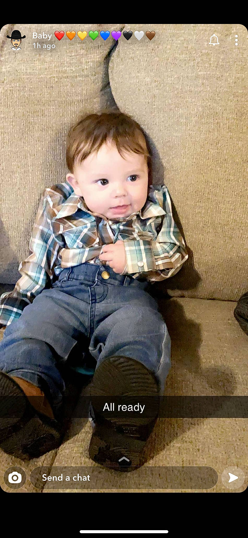 Holden is registered to the contest to win money with this photo: baby_toddler_clothing, cheek, child, comfort, denim, ear, eye, face, flooring, human, jeans, mouth, nose, person, plaid, shoe, sitting, t_shirt, textile, toddler
