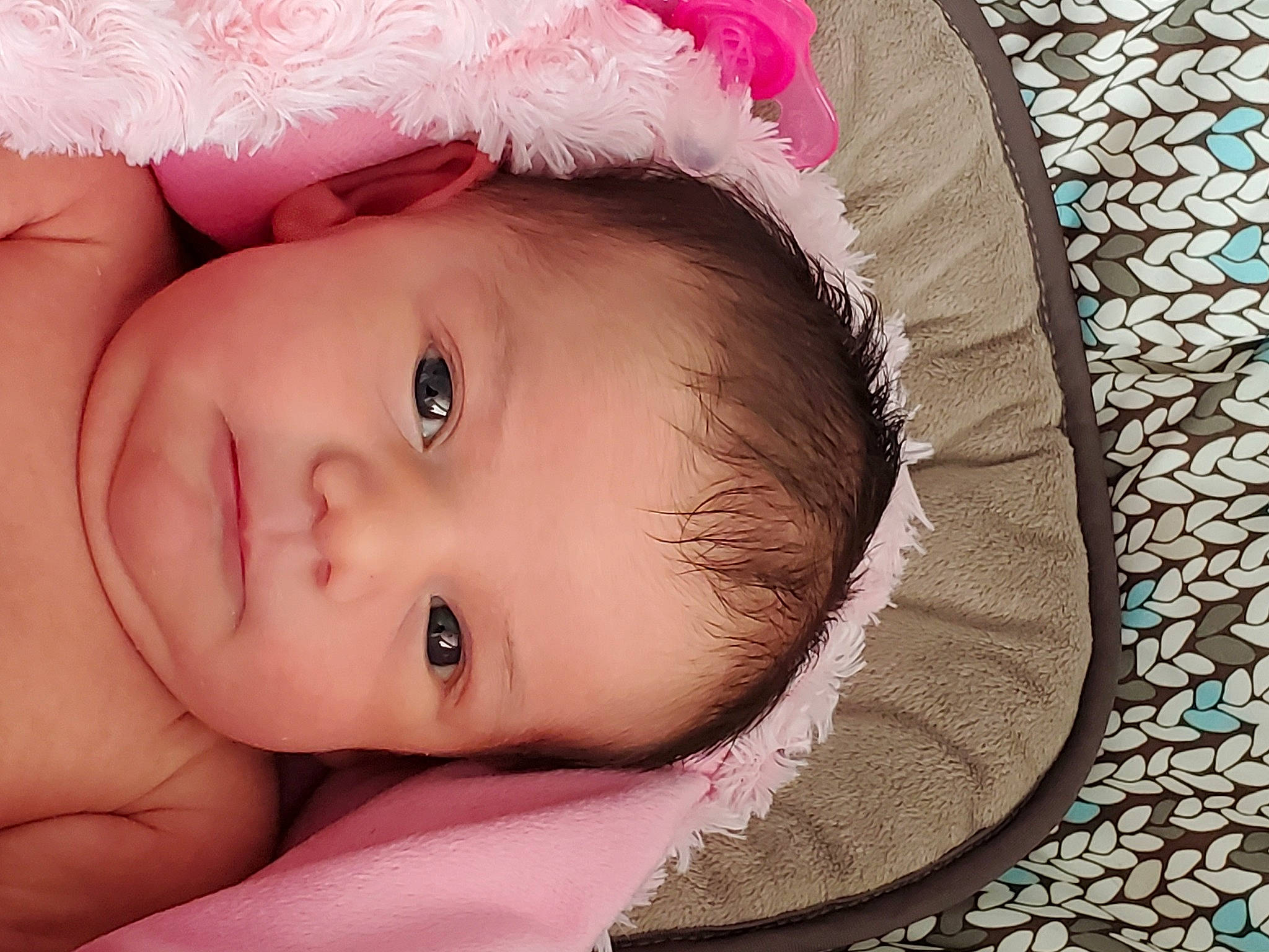 Coraline is registered to the contest to win money with this photo: baby, beauty, cheek, child, close_up, eye, face, hair_accessory, head, headgear, iris, lip, mouth, nose, person, photography, pink, portrait_photography, product, skin