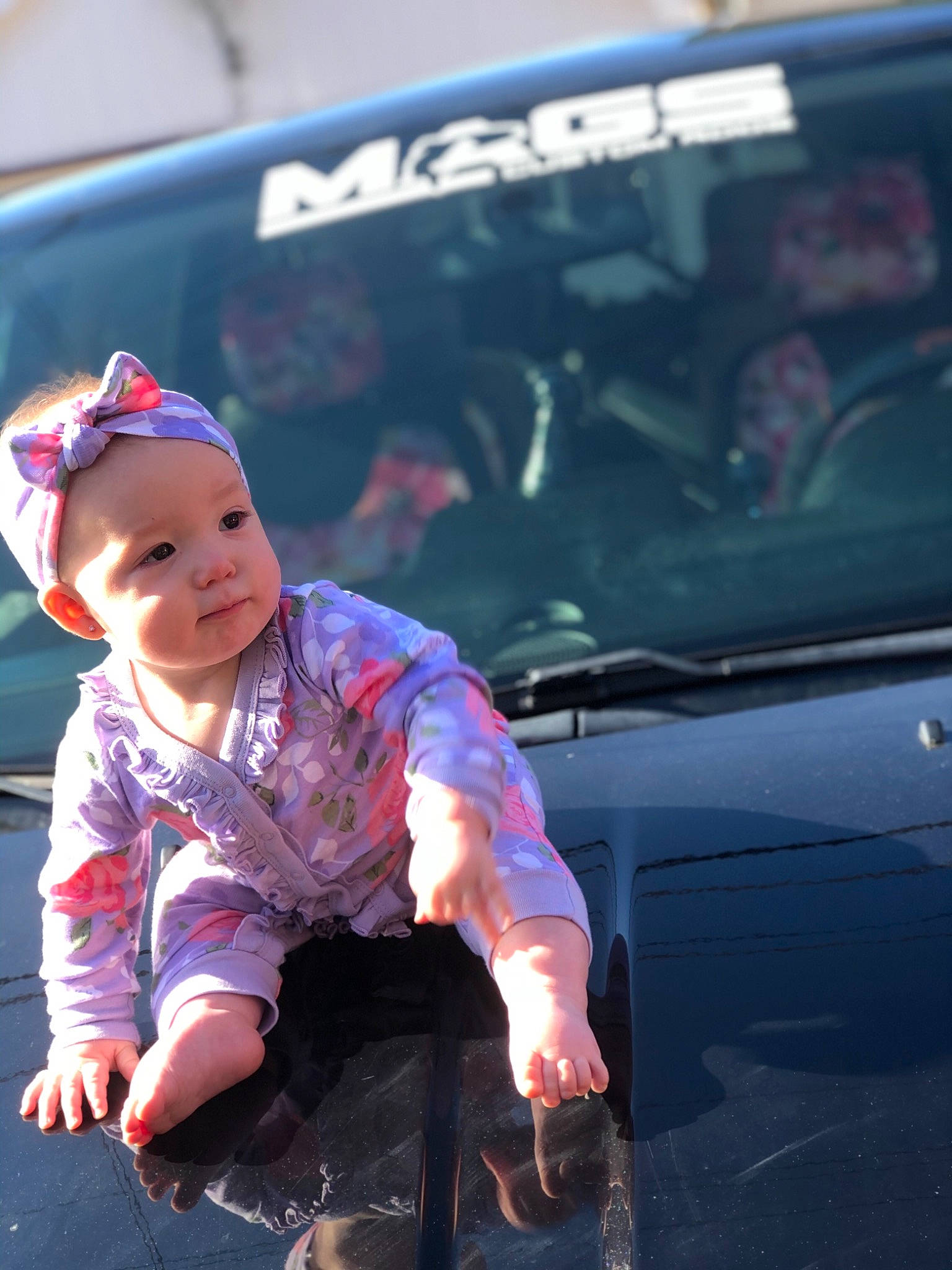 Amarah is registered to the contest to win money with this photo: automotive_design, automotive_exterior, automotive_lighting, automotive_tire, baby, baby_toddler_clothing, bumper, car, flash_photography, happy, hat, headwear, hood, motor_vehicle, person, personal_luxury_car, t_shirt, tints_and_shades, toddler, trunk