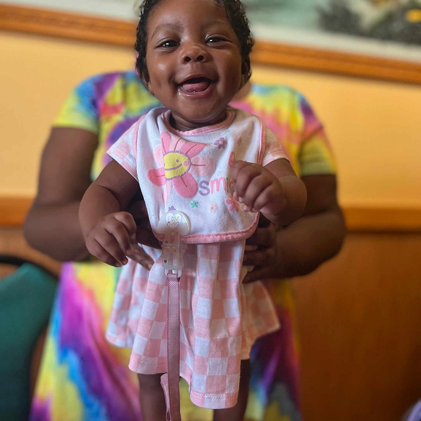 Naomi is registered to the contest to win money with this photo: bodypart, child, clothing, couch, crying, dress, face, female, finger, footwear, furniture, girl, hand, happy, head, person, photography, portrait, shoe, smile