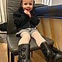 Rose participe au concours pour gagner de l'argent avec cette photo : toddler, child, smile, boots, black_boots, black_sweater, gray_chair, indoor, floor, laundry_basket, bed, happy, cute, fashion, seated, legs, white_tights, playful, cozy, casual