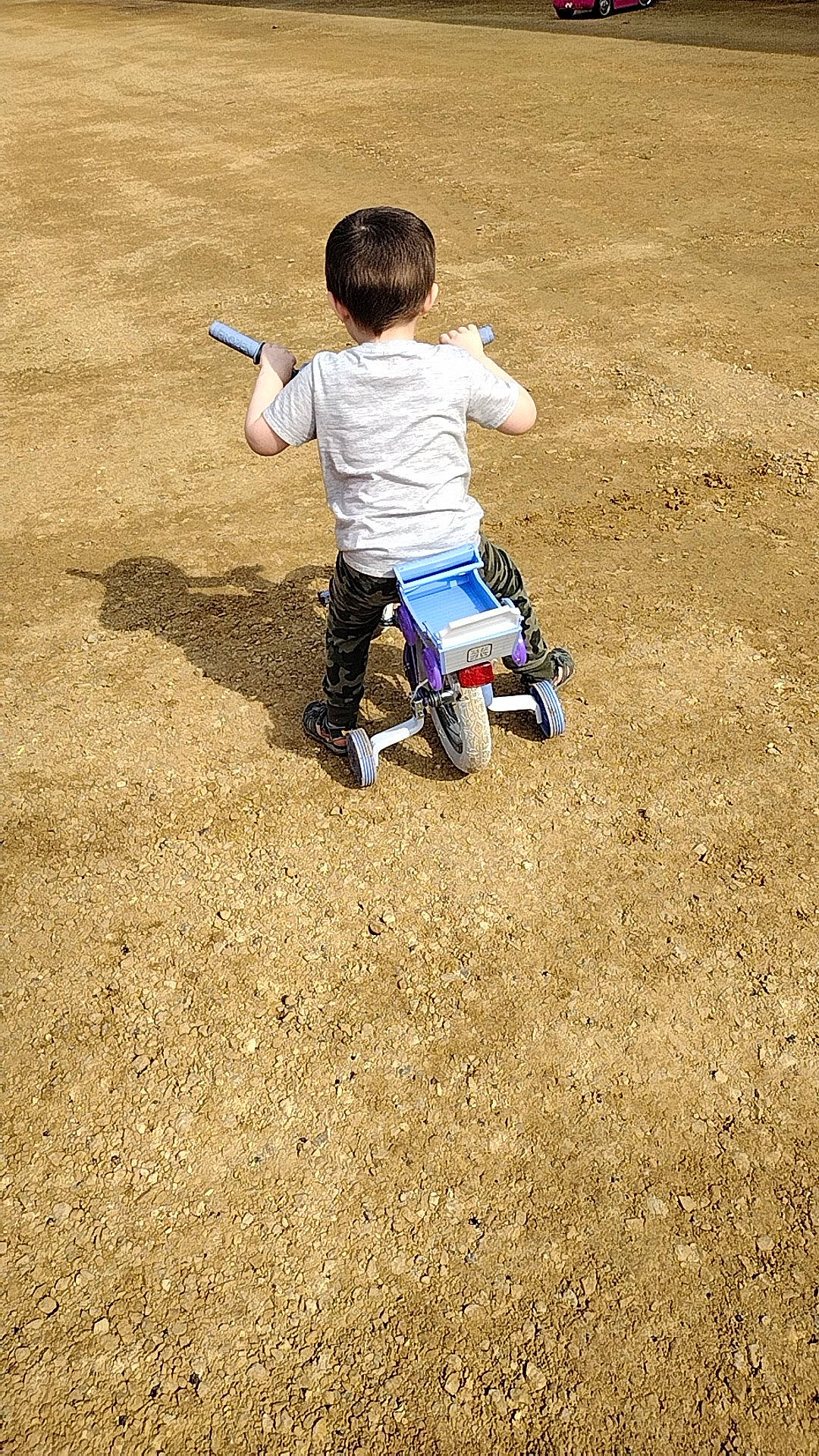 Colton joined the competition — help win amazing prizes! asphalt, baby, child, flooring, fun, grass, jeans, landscape, leisure, people_in_nature, person, play, recreation, road_surface, sand, shadow, sitting, soil, t_shirt, toddler