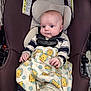baby, car_seat, blanket, winnie_the_pooh, child, infant, straps, clothing, cute, face, hands, indoor, seat, safety, cart, expression, person, young, portrait, comfort