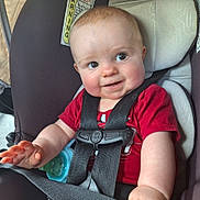 Dustin joined the competition — help win amazing prizes! baby, car_seat, cheeks, child, closeup, cute, face, hand, happy, indoors, infant, person, red_shirt, safety_harness, seat, seatbelt, sippy_cup, smile, straps, young_child