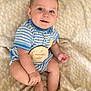 baby, infant, child, striped_clothing, blue, onesie, plaque, 5_months_old, milestone, sitting, blanket, soft_texture, smile, cute, portrait, hand, foot, skin, indoor, closeup