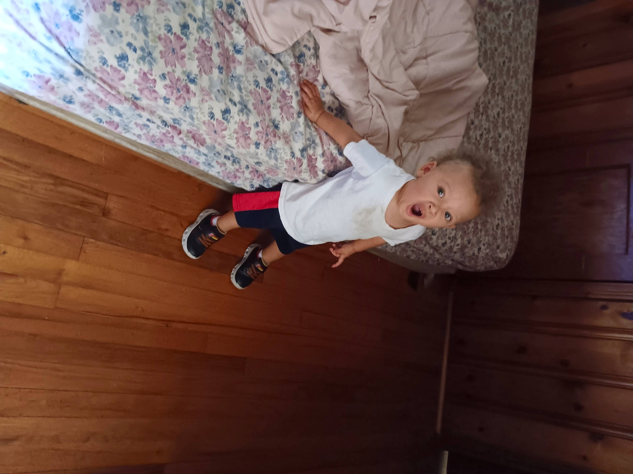 Ashton joined the competition — help win amazing prizes! arm, baby, baby_toddler_clothing, child, comfort, elbow, floor, flooring, fun, hardwood, human_leg, knee, pattern, person, sitting, sock, surprise, thigh, toddler, wood