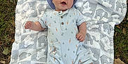 Mylo is registered to the contest to win money with this photo: baby, blanket, carrot_print, child, cute, elephant_pattern, fall, grass, happy, hat, infant, leaves, lying_down, nature, onesie, outdoor, portrait, smiling, soft_texture, white_socks