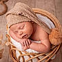 Enzo participe au concours pour gagner de l'argent avec cette photo : baby, basket, blanket, cozy, cute, dried_grasses, hat, indoors, infant, knitted_hat, natural_light, newborn, peaceful, pom_pom, portrait, resting, sleeping, soft, wicker, wooden_floor