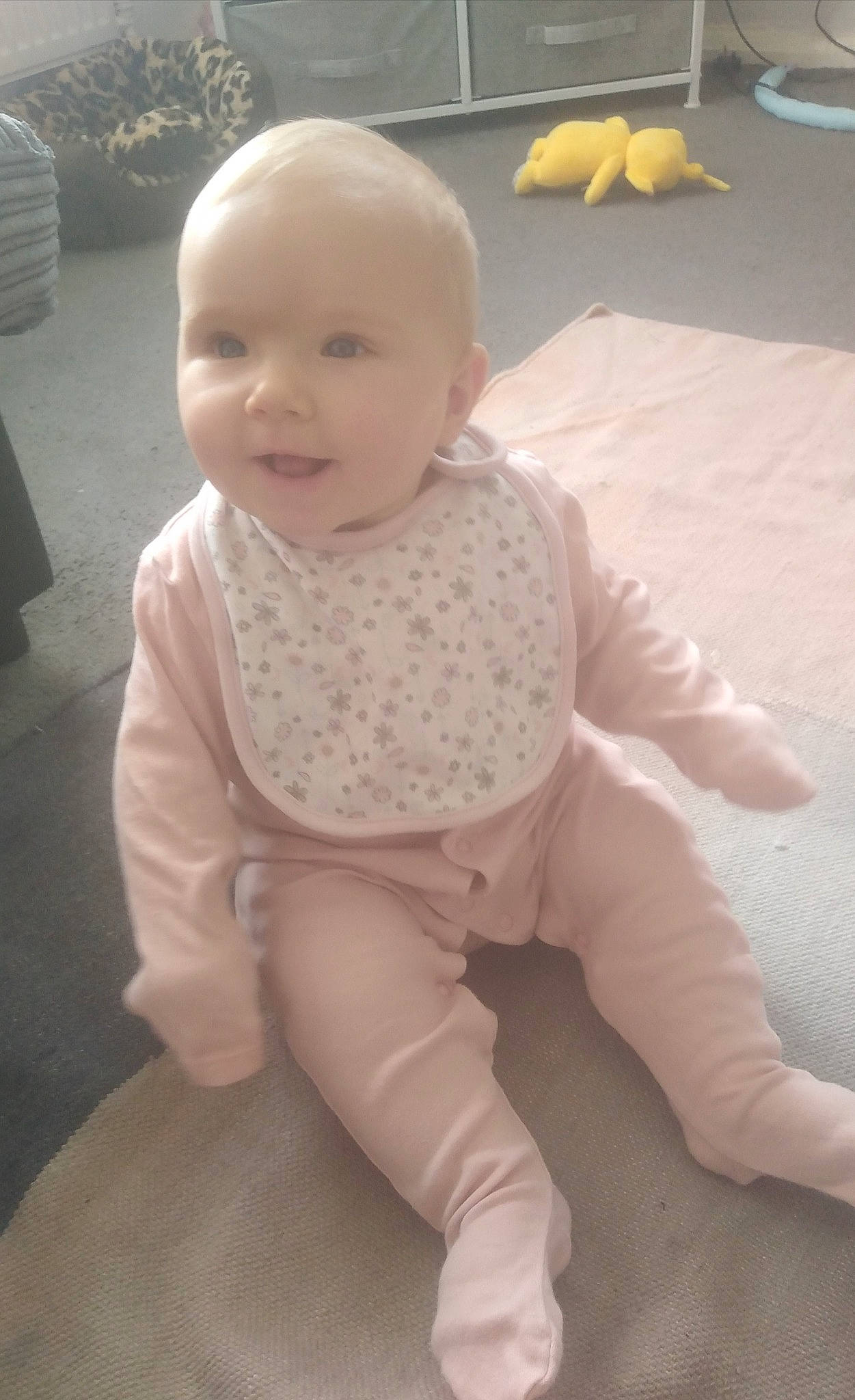 Lexie joined the competition — help win amazing prizes! baby, baby_toddler_clothing, carpet, cheek, child, comfort, floor, flooring, happy, hardwood, joint, knee, linens, person, sitting, skin, sleeve, smile, thumb, toddler