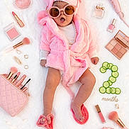 Emma is registered to the contest to win money with this photo: baby, infant, pink, robe, sunglasses, slippers, makeup, cosmetics, jewelry, hairdryer, cucumber_slices, milestone, months, blanket, accessories, cute, fashion, portrait, child, laying_down
