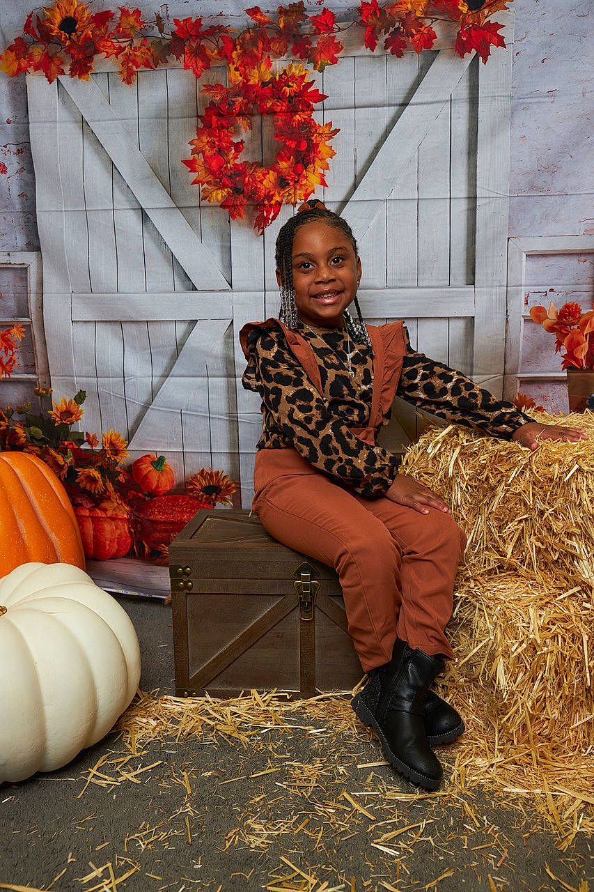 Amani is registered to the contest to win money with this photo: boot, calabaza, cucurbita, door, gourd, grass, happy, hat, human_leg, joy, leaf, orange, people_in_nature, person, plant, pumpkin, shoe, smile, tints_and_shades, tree