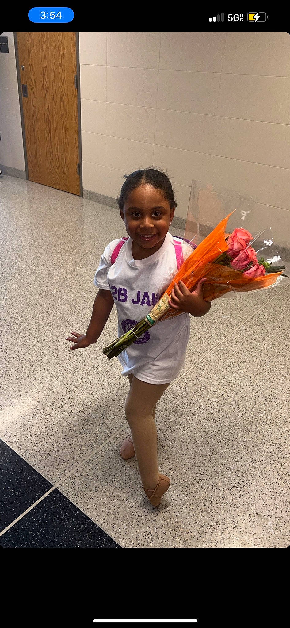 Amani joined the competition — help win amazing prizes! barefoot, child, entertainment, event, face, flooring, fun, happy, human_leg, joy, leisure, performing_arts, person, play, recreation, sandal, sitting, smile, sportswear, t_shirt