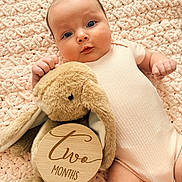 Lia joined the competition — help win amazing prizes! baby, infant, child, portrait, lying_down, smiling, wide_eyed, pink_outfit, blanket, plush_toy, bunny, stuffed_animal, wooden_sign, milestone, two_months, nursery, cozy, indoors, close_up, photography