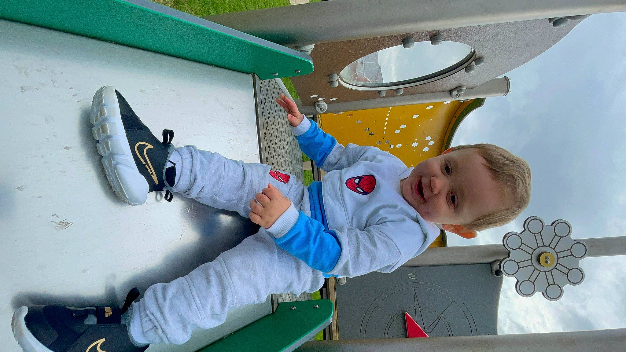 Kylo is registered to the contest to win money with this photo: baby, baby_toddler_clothing, boot, ceiling, child, circle, electric_blue, fun, glove, happy, joy, leisure, outdoor_shoe, person, personal_protective_equipment, play, recreation, sitting, smile, space