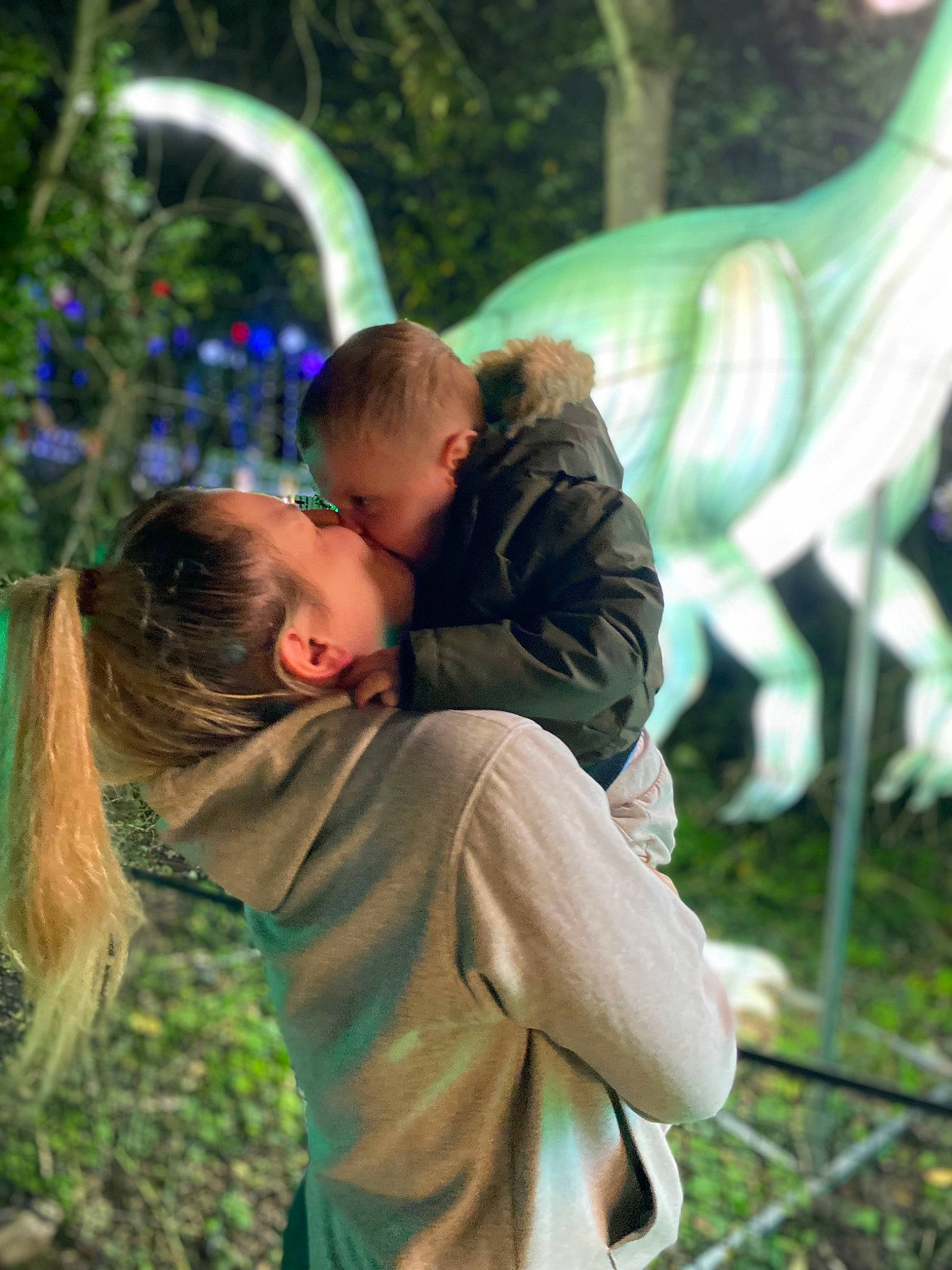 Kylo is registered to the contest to win money with this photo: botany, event, fun, gesture, grass, grassland, happy, hug, kiss, lawn, leaf, leisure, people_in_nature, person, plant, recreation, romance, t_shirt, toddler, tree