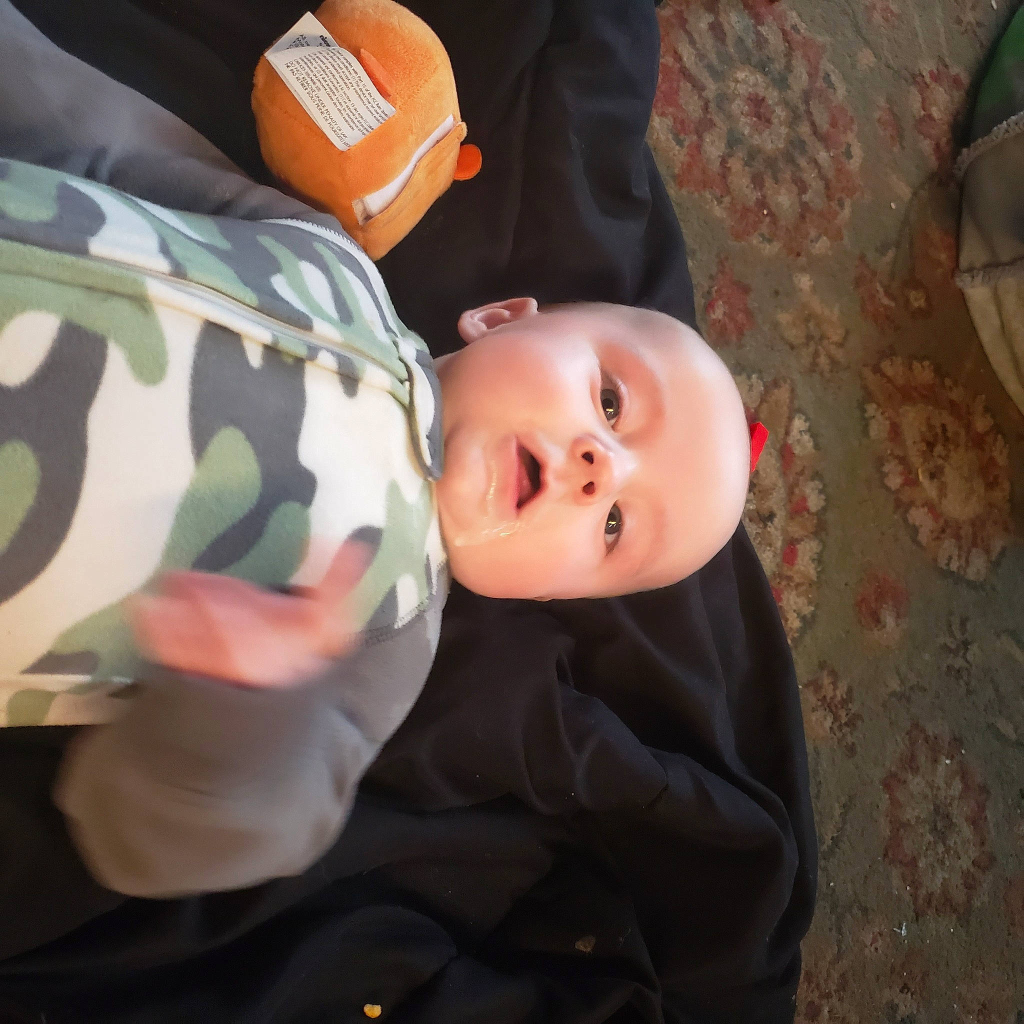 Benjamin is registered to the contest to win money with this photo: baby, baby_carriage, baby_products, baby_toddler_clothing, cheek, child, comfort, fun, person, room, sitting, sleeve, toddler, tree, wood