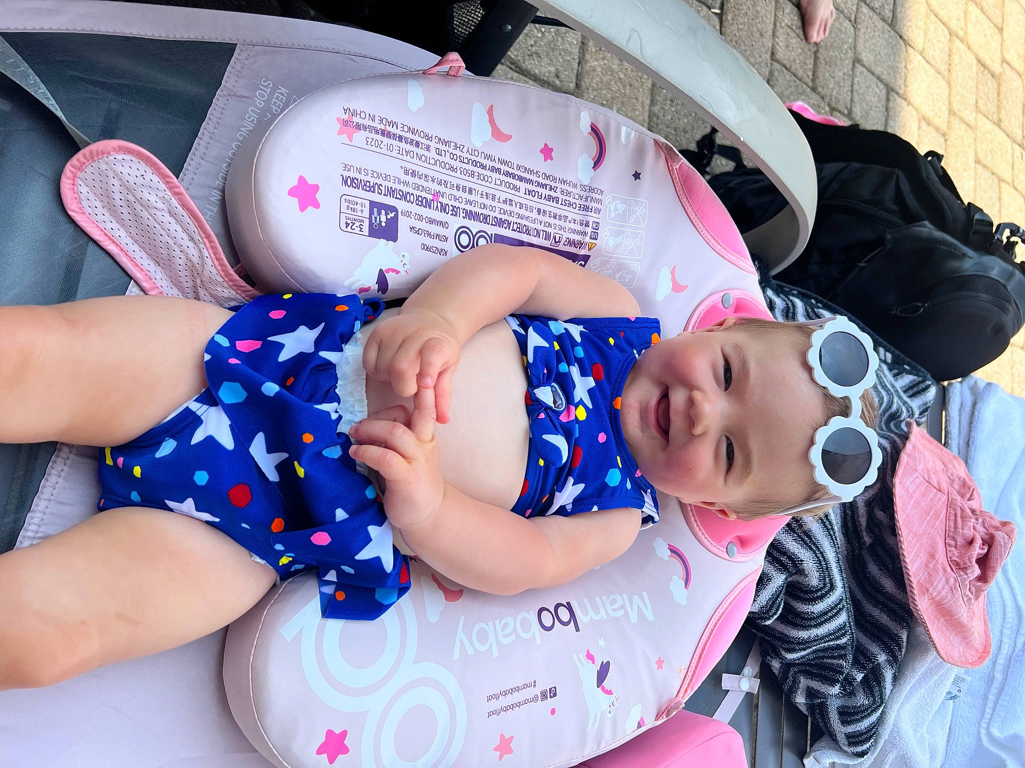 Sunny joined the competition — help win amazing prizes! baby, baby_carriage, baby_products, baby_toddler_clothing, child, fun, happy, hat, headgear, human_leg, joy, pattern, person, pink, sitting, summer, textile, thigh, toddler, vacation