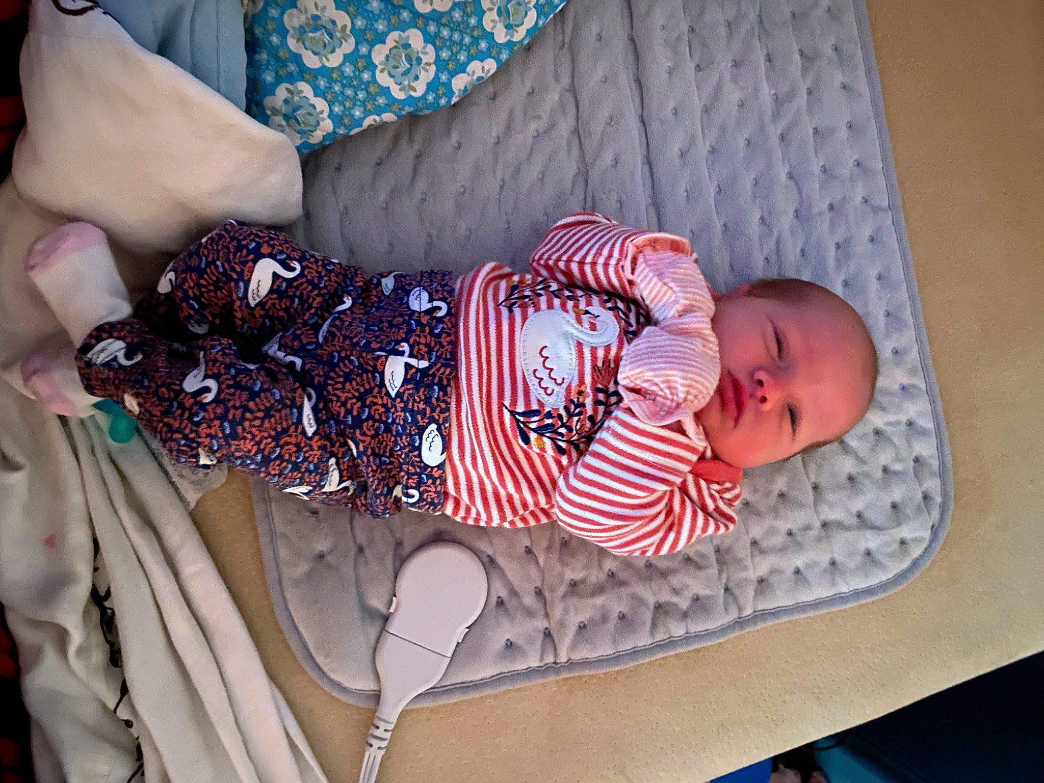 Harper joined the competition — help win amazing prizes! baby, baby_products, baby_safety, baby_sleeping, baby_toddler_clothing, blue, child, comfort, human_leg, linens, pattern, person, pink, product, room, sitting, sleeve, sock, thigh, toddler