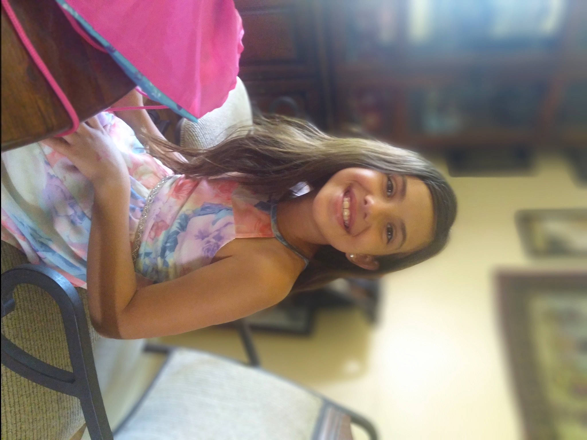 Tristen is registered to the contest to win money with this photo: arm, chair, child, dress, fun, happy, human_body, human_leg, joy, leg, leisure, long_hair, magenta, person, room, sitting, skin, smile, thigh, trunk