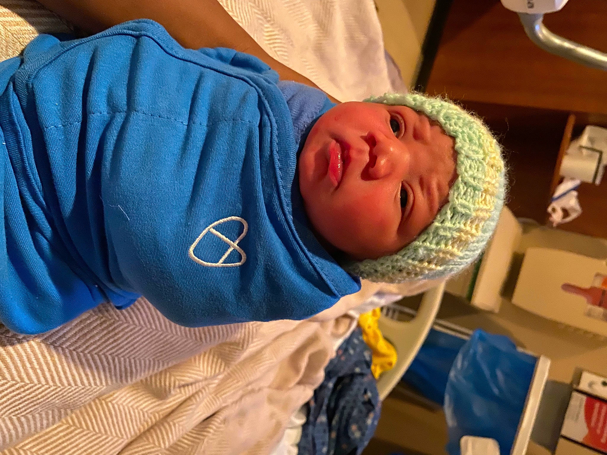 Jamani is registered to the contest to win money with this photo: abdomen, baby, chest, child, comfort, elbow, electric_blue, hat, headwear, hospital, hospital_bed, hospital_gown, linens, nap, person, room, sleep, sleeve, smile, t_shirt