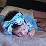 Katie is registered to the contest to win money with this photo: baby, bedroom, blanket, blue_dress, bow, child, closeup, curly_hair, cute, face, hand, headband, indoors, infant, lying_down, person, pillow, sleepwear, soft_texture, toddler