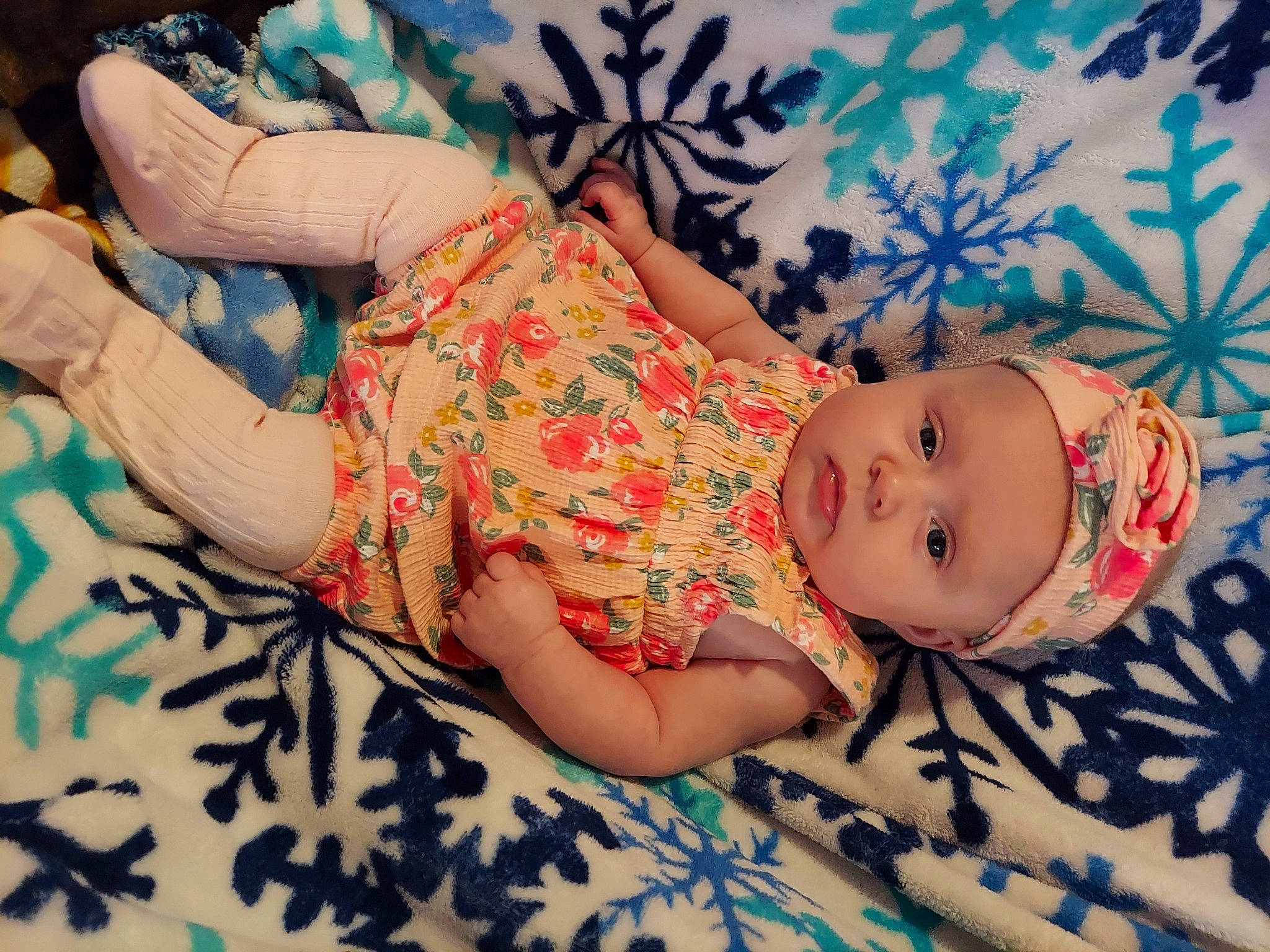 Amber joined the competition — help win amazing prizes! baby, baby_toddler_clothing, cheek, child, comfort, finger, hand, happy, hat, headgear, headwear, human_body, human_leg, linens, pattern, person, pink, skin, sleeve, smile